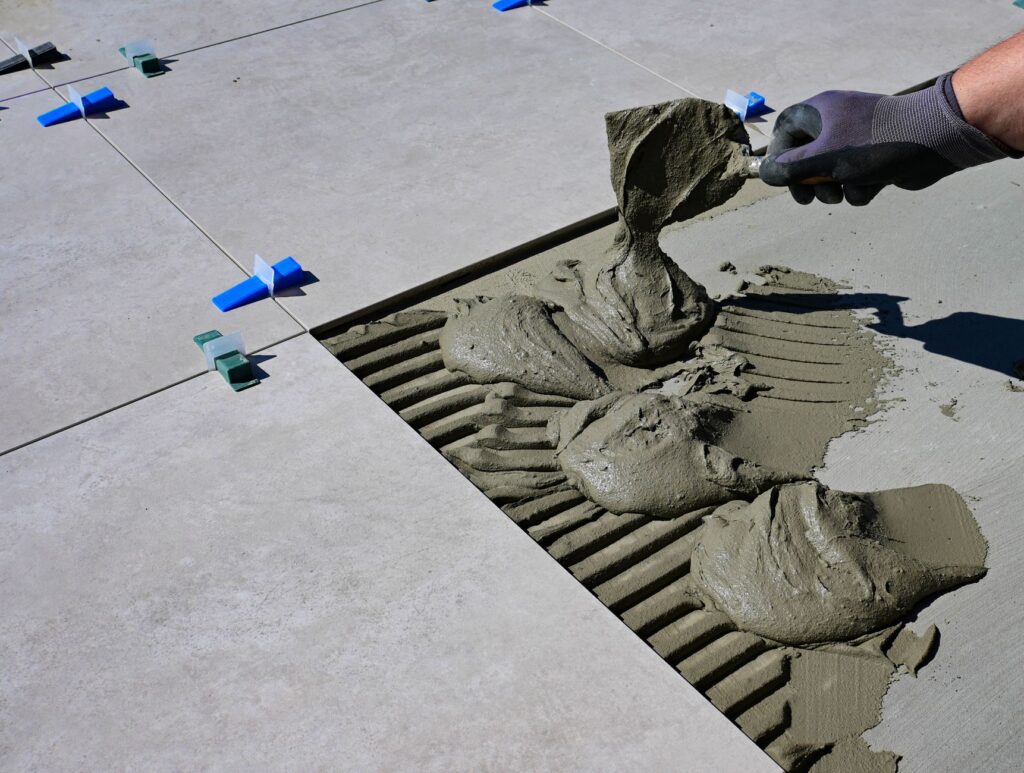Tile being set in mortar during installation