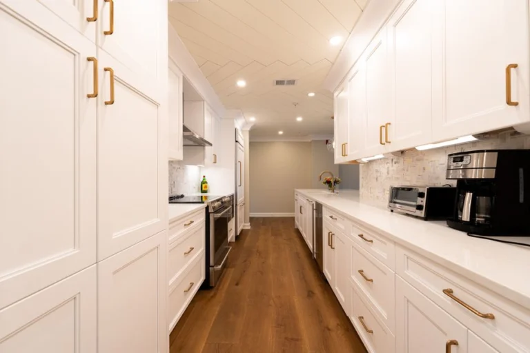 White kitchen with wood floors